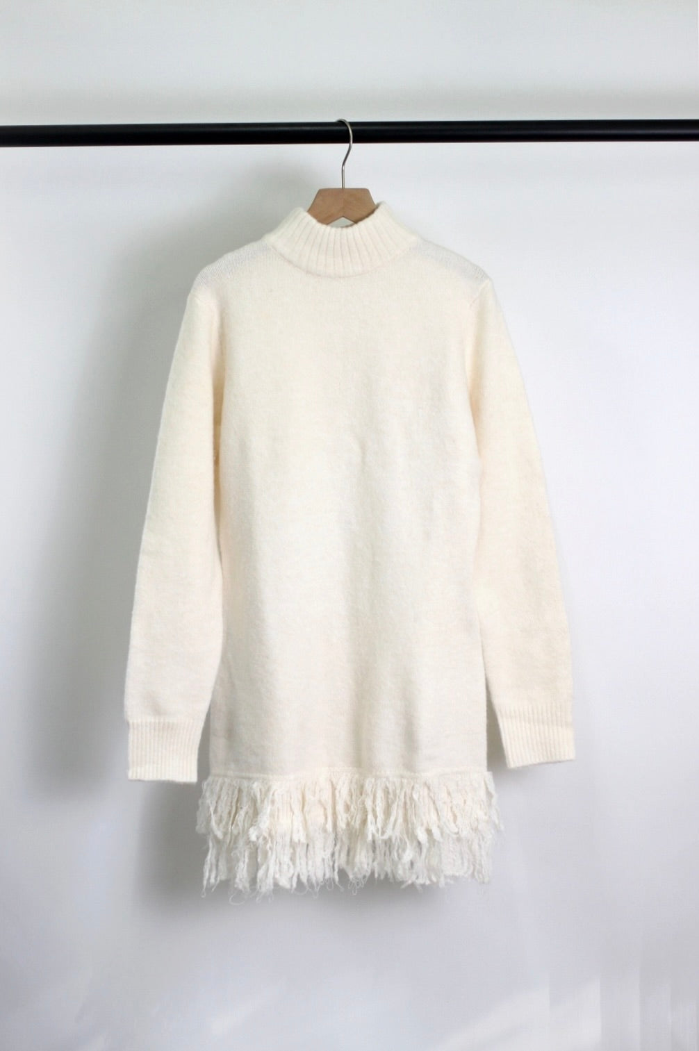 Knit sweater dress with fringed hem
